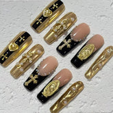 Luxurious Handmade Nail Art: Gold, Black and Nude Fusion with Religious Embellishments D059