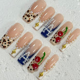 Stylish Handmade Nail Art: Nude - Inspired Designs with Leopard Print, Cherry and Pearl Embellishments D072