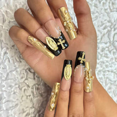 Luxurious Handmade Nail Art: Gold, Black and Nude Fusion with Religious Embellishments D059