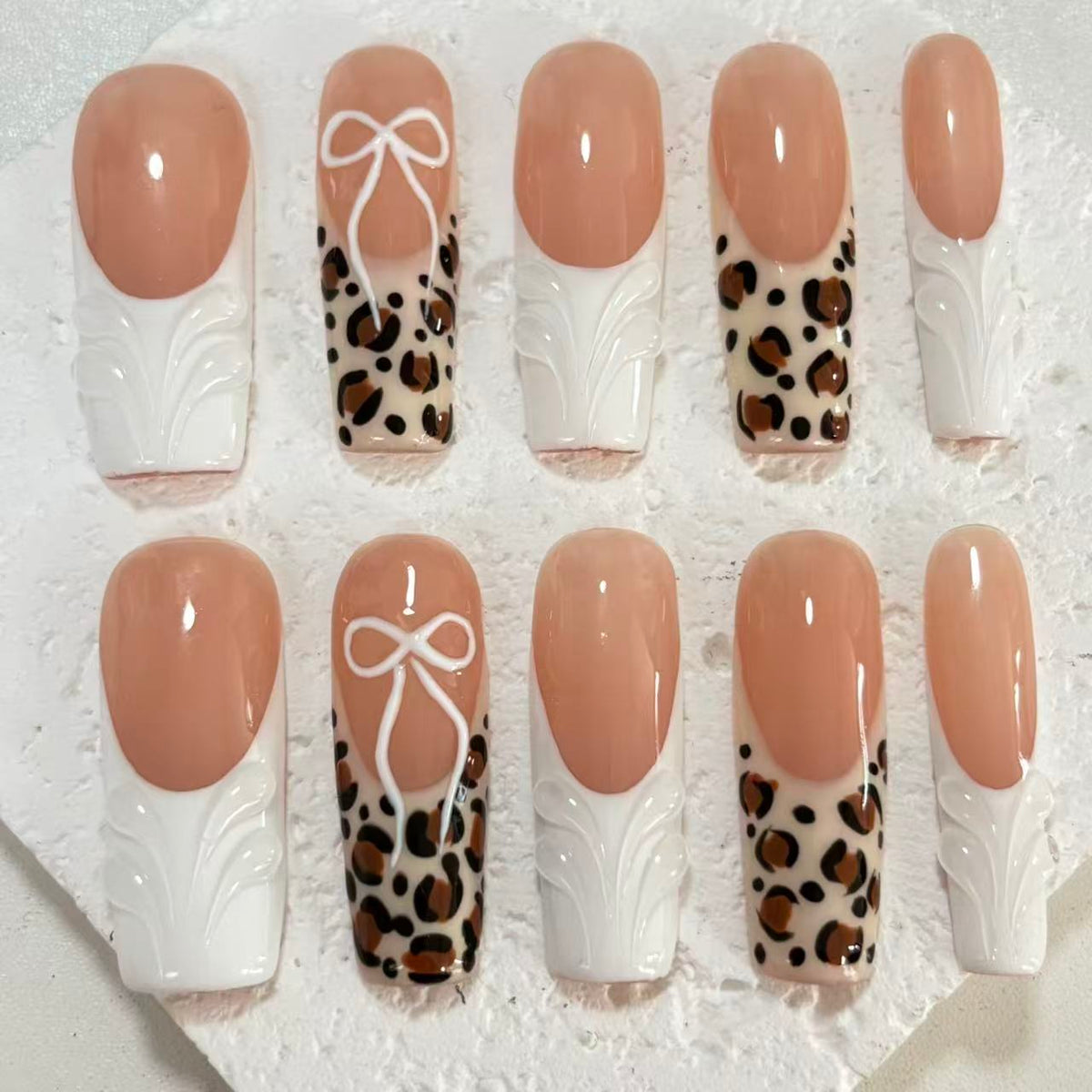 Chic Handmade Nude - White Nail Art with Leopard Print and Bow Accents D070