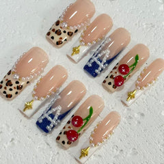 Stylish Handmade Nail Art: Nude - Inspired Designs with Leopard Print, Cherry and Pearl Embellishments D072