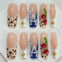 Stylish Handmade Nail Art: Nude - Inspired Designs with Leopard Print, Cherry and Pearl Embellishments D072