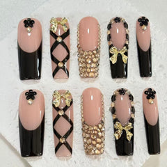 Elegant Handmade Nail Art: Black - Nude Fusion with Bow, Flower and Crystal Embellishments D073