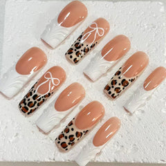 Chic Handmade Nude - White Nail Art with Leopard Print and Bow Accents D070