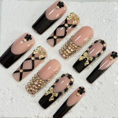 Elegant Handmade Nail Art: Black - Nude Fusion with Bow, Flower and Crystal Embellishments D073