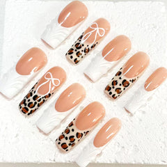 Chic Handmade Nude - White Nail Art with Leopard Print and Bow Accents D070