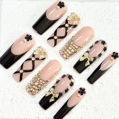 Elegant Handmade Nail Art: Black - Nude Fusion with Bow, Flower and Crystal Embellishments D073